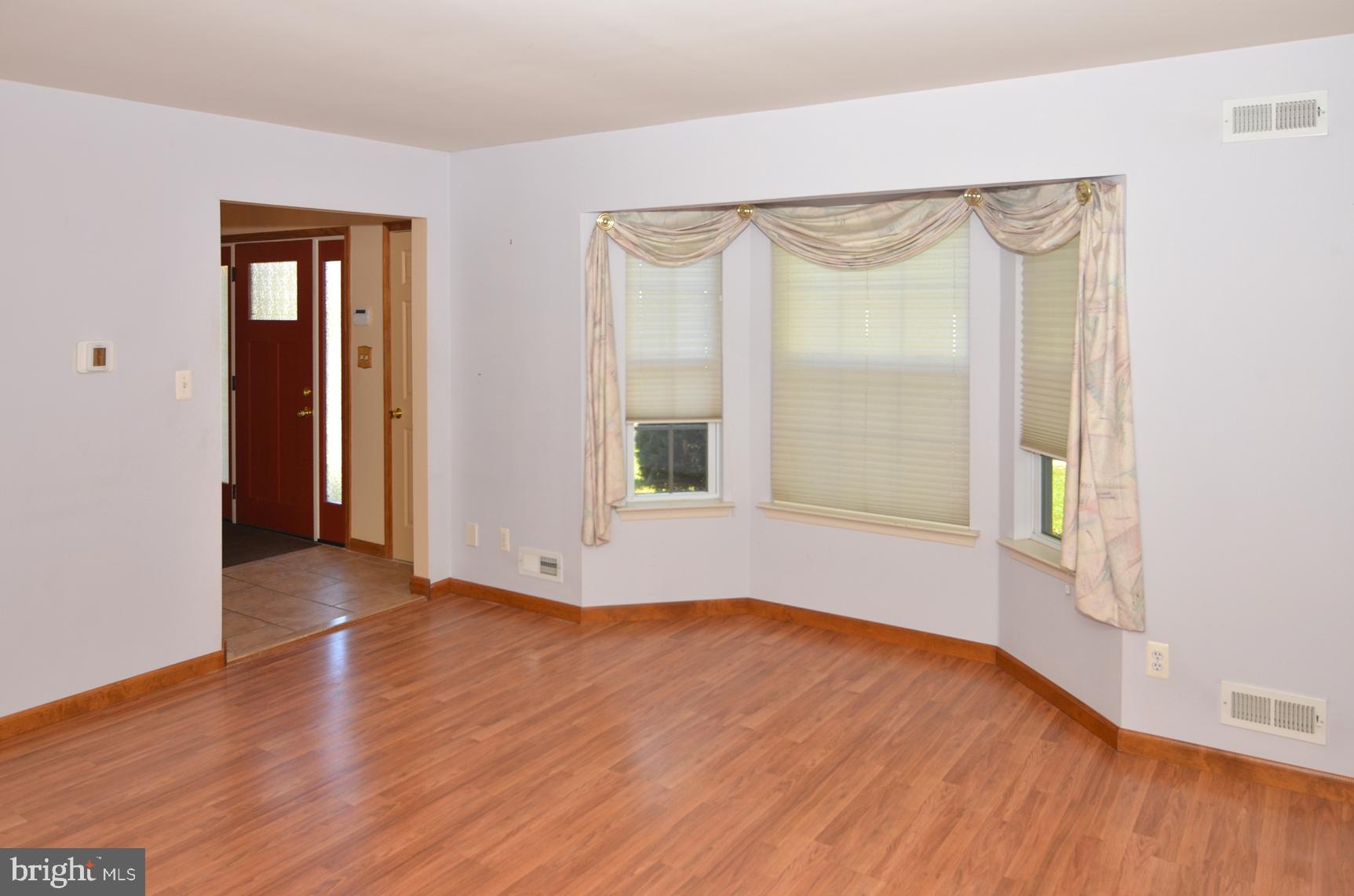 9 Noa Court Hamilton, NJ 08690 - Photo 8 of 47 an empty room with wooden floor and windows