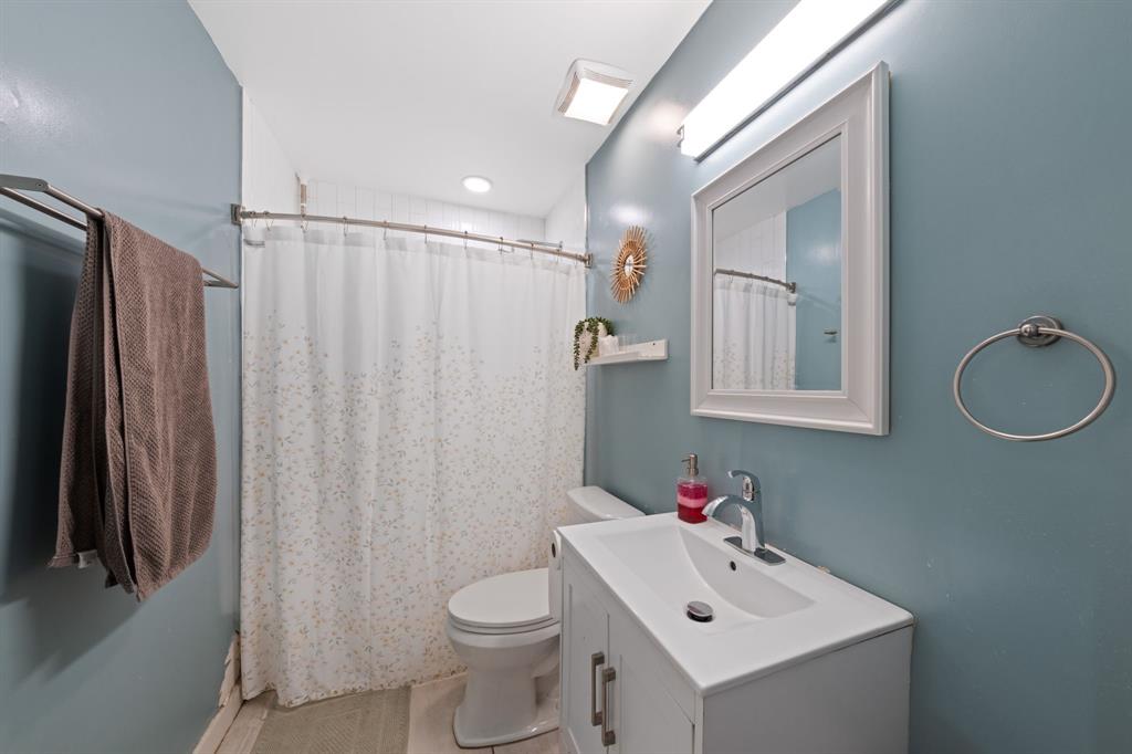 2114 Engle Avenue Dallas, TX 75224 - Photo 15 of 27 a white toilet sitting next to a bathroom sink