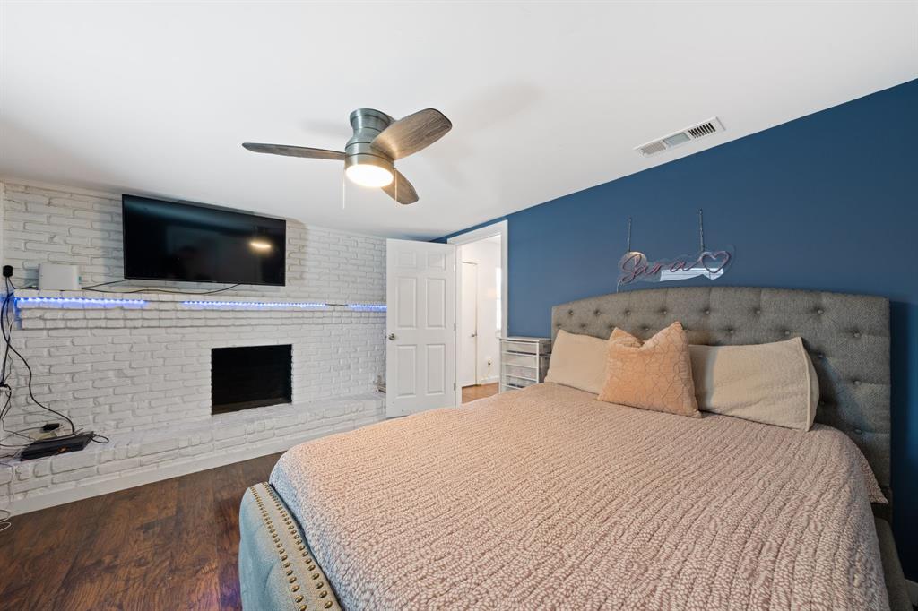 2114 Engle Avenue Dallas, TX 75224 - Photo 17 of 27 a bedroom with a bed and a flat screen tv