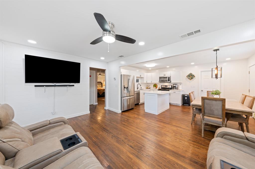 2114 Engle Avenue Dallas, TX 75224 - Photo 2 of 27 a living room with furniture and a flat screen tv