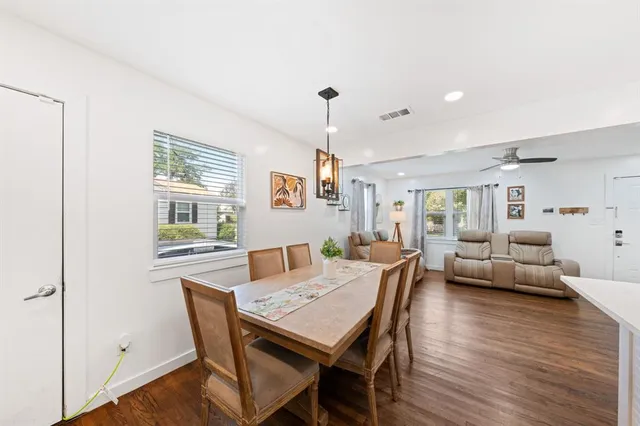 a view of a dining room with furniture window and wooden floor