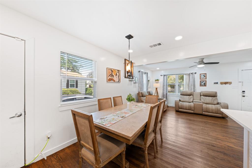 2114 Engle Avenue Dallas, TX 75224 - Photo 5 of 27 a view of a dining room with furniture window and wooden floor
