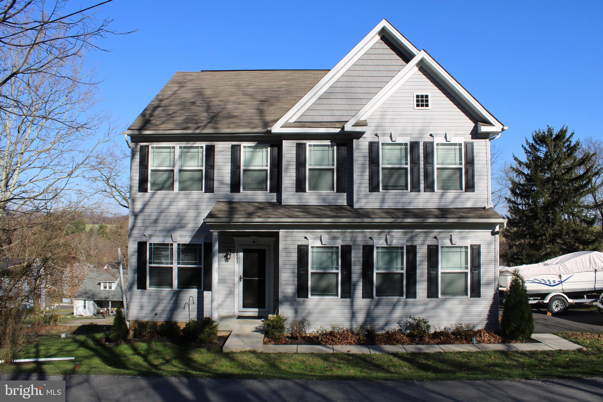 a front view of a house with a yard