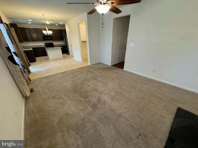a view of a hallway with a flat screen tv