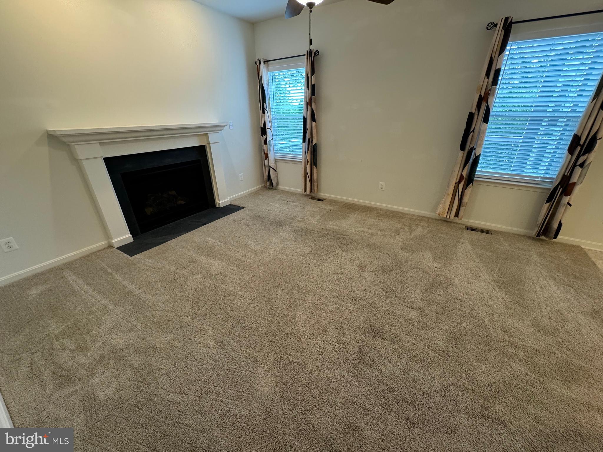 1003 Chestnut Street Delta, PA 17314 - Photo 12 of 27 a view of an empty room with wooden floor and a fireplace