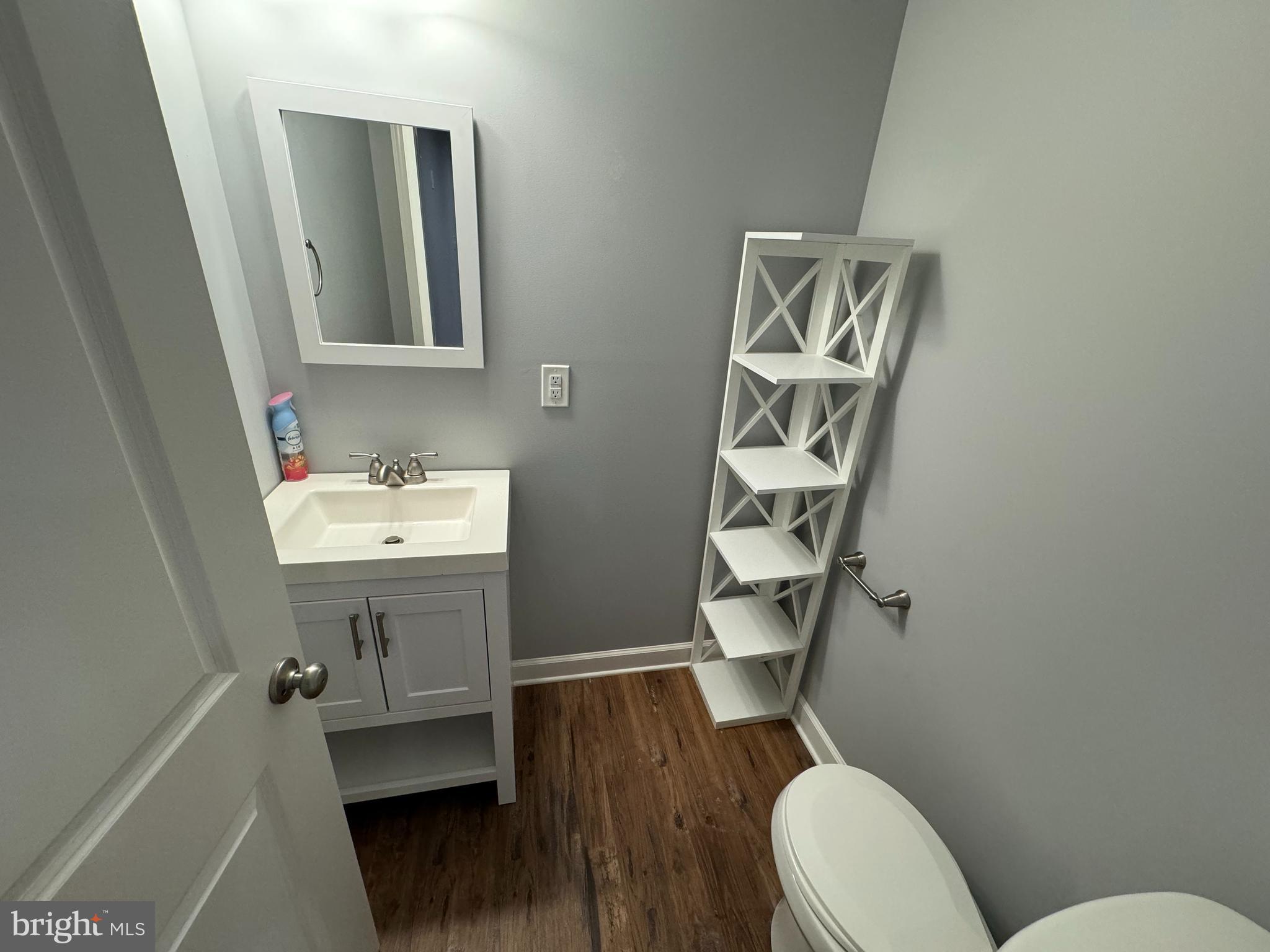 1003 Chestnut Street Delta, PA 17314 - Photo 21 of 27 a bathroom with a sink mirror vanity and toilet
