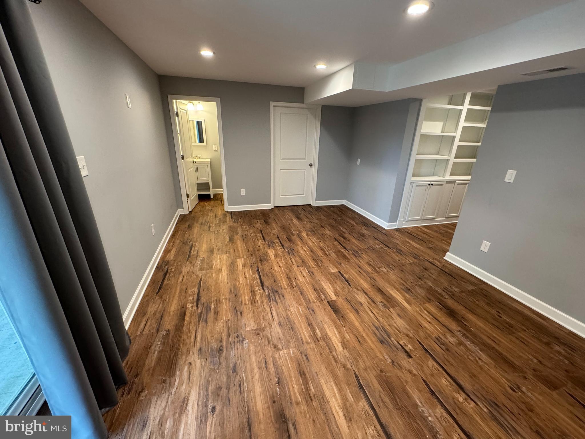 1003 Chestnut Street Delta, PA 17314 - Photo 22 of 27 a view of empty room with wooden floor and fan