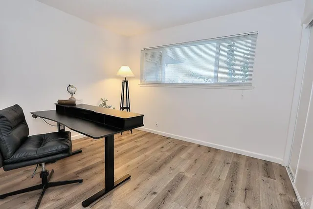 a view of a livingroom with furniture and a table