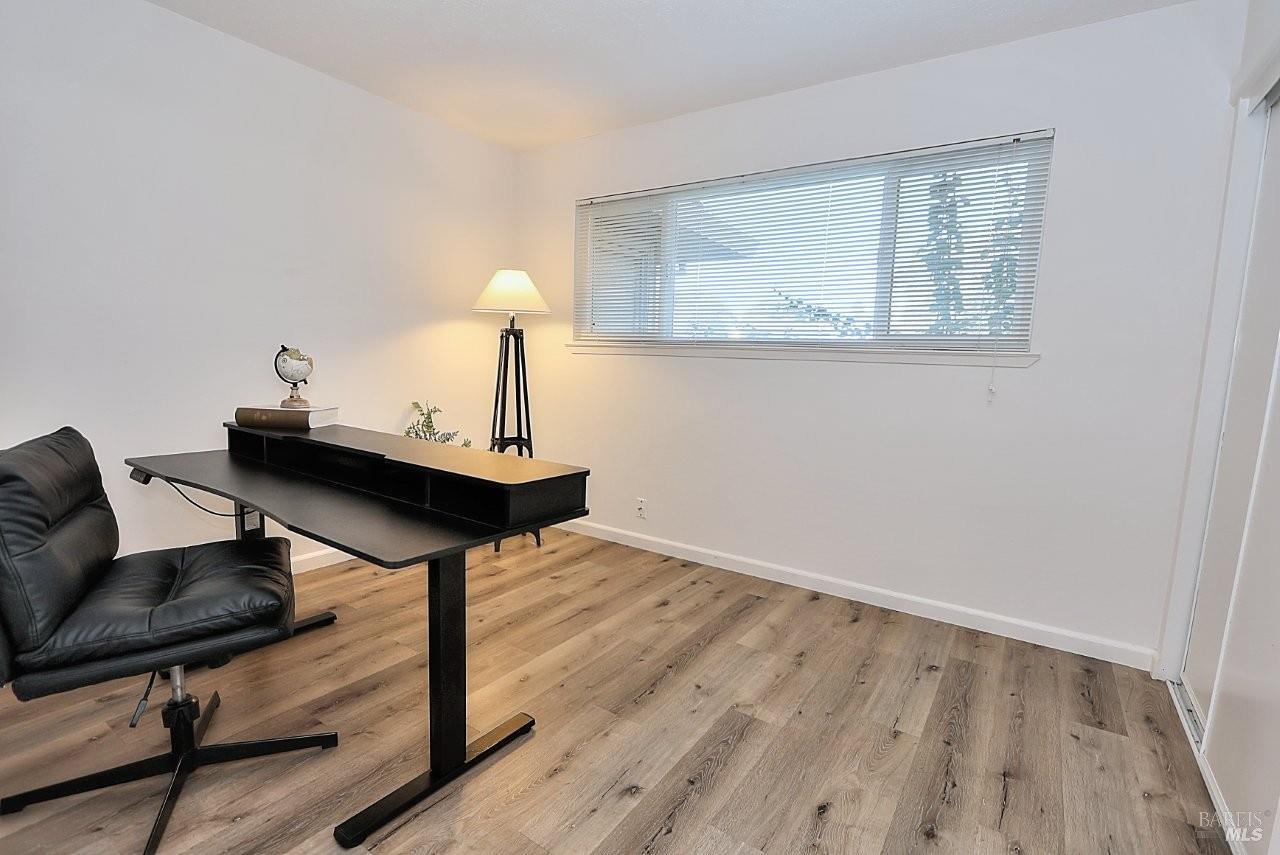 1970 Peabody Road, Unit 1 Vacaville, CA 95687 - Photo 12 of 16 a room with wooden floor and windows
