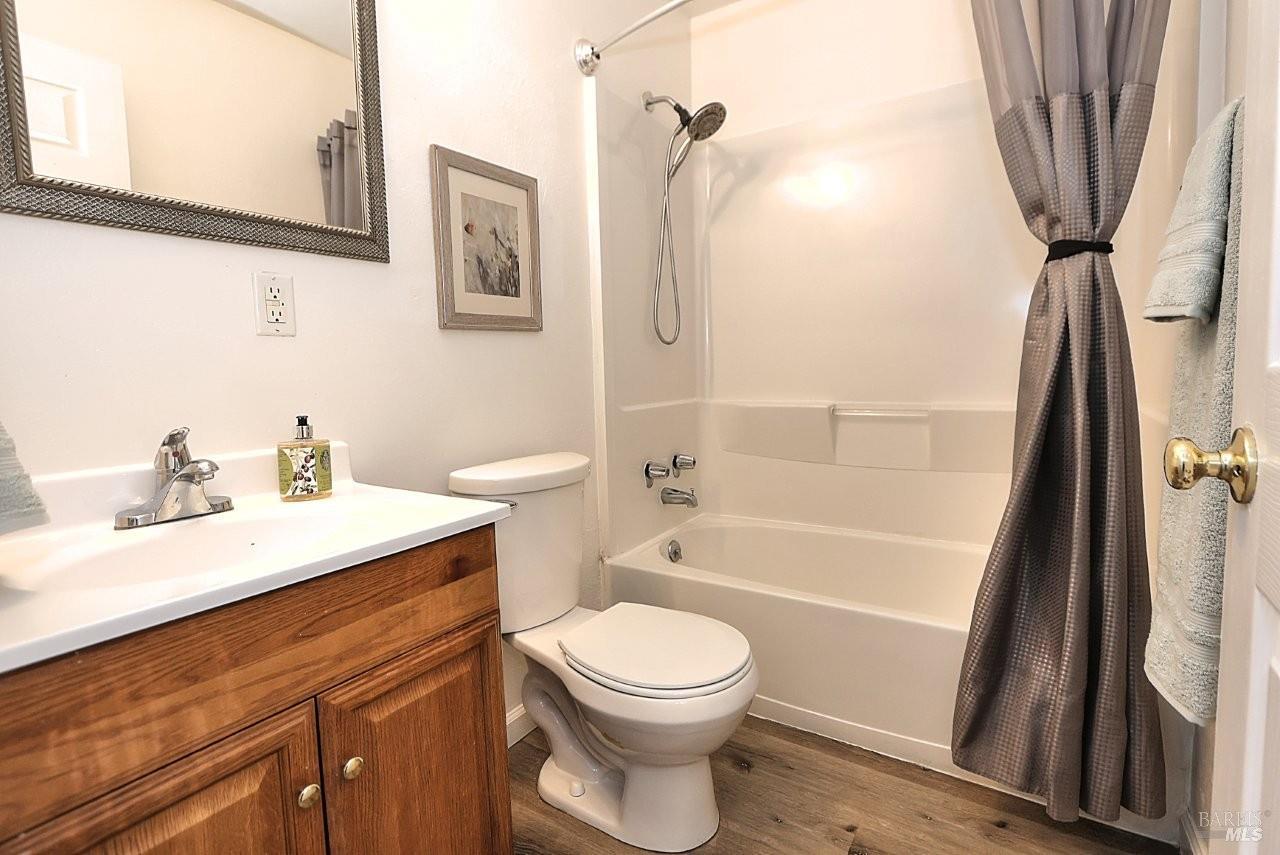 1970 Peabody Road, Unit 1 Vacaville, CA 95687 - Photo 13 of 16 a bathroom with a sink a toilet and shower