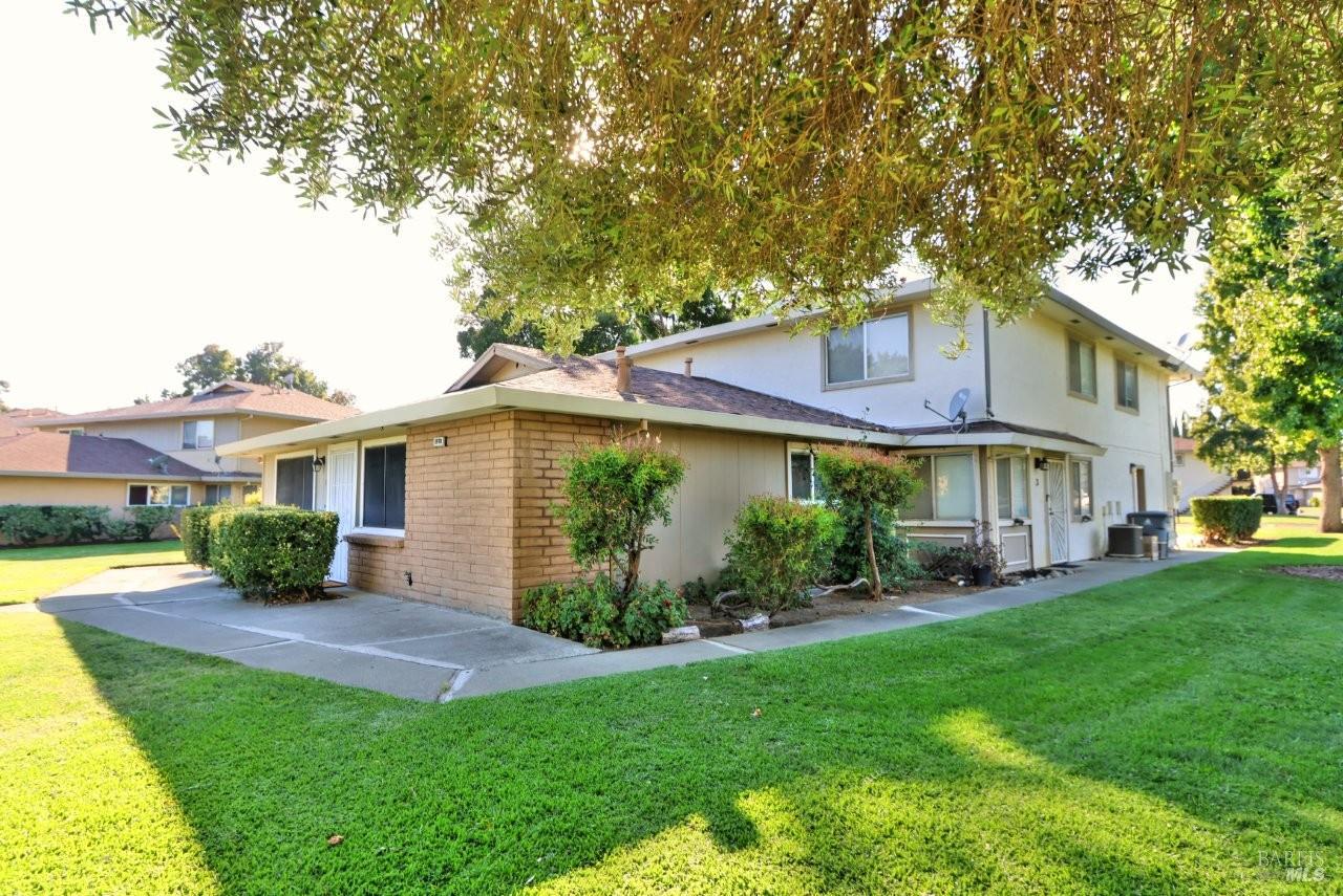 1970 Peabody Road, Unit 1 Vacaville, CA 95687 - Photo 3 of 16 a front view of a house with a yard and potted plants