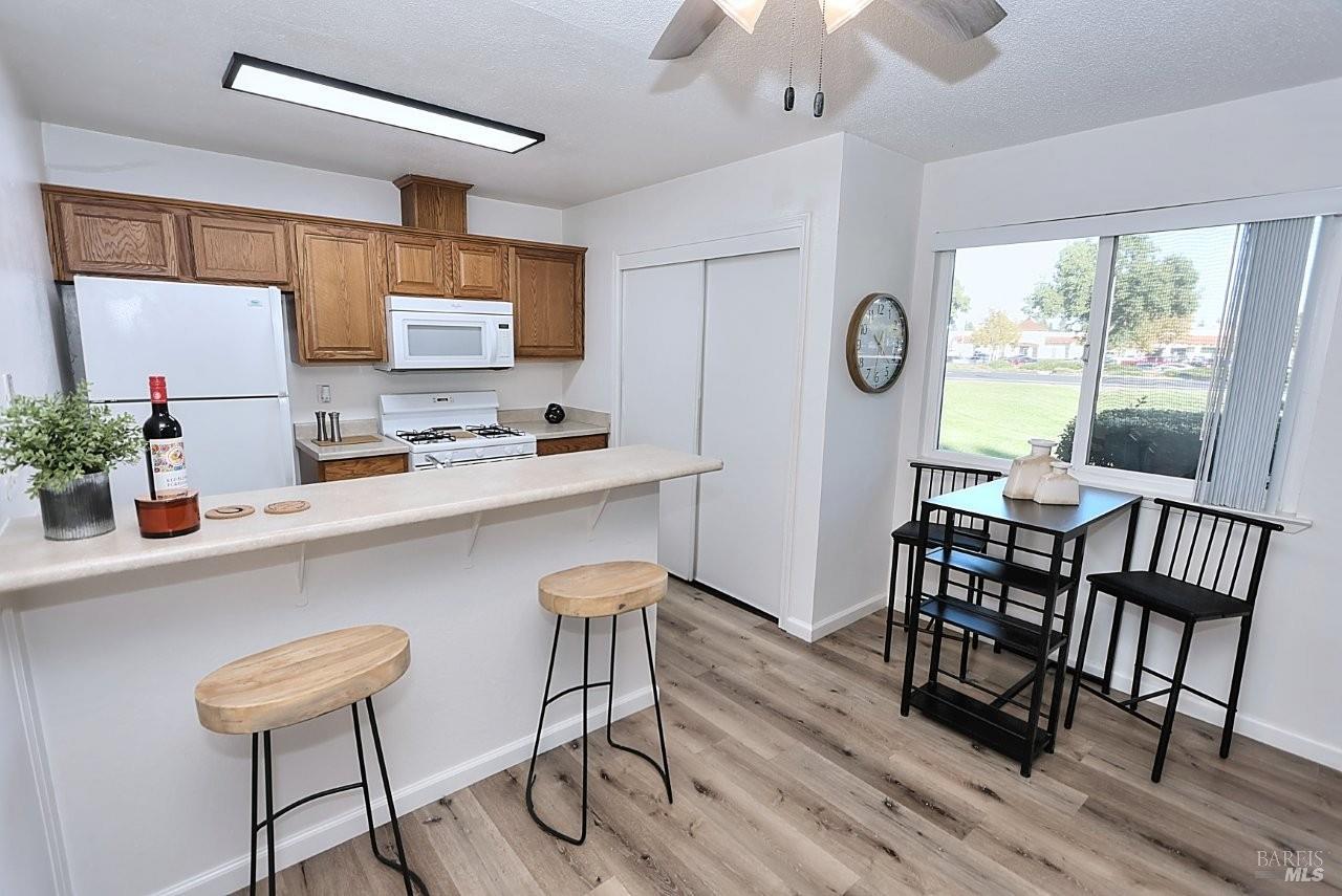 1970 Peabody Road, Unit 1 Vacaville, CA 95687 - Photo 5 of 16 a very nice looking dining room with furniture window and wooden floor