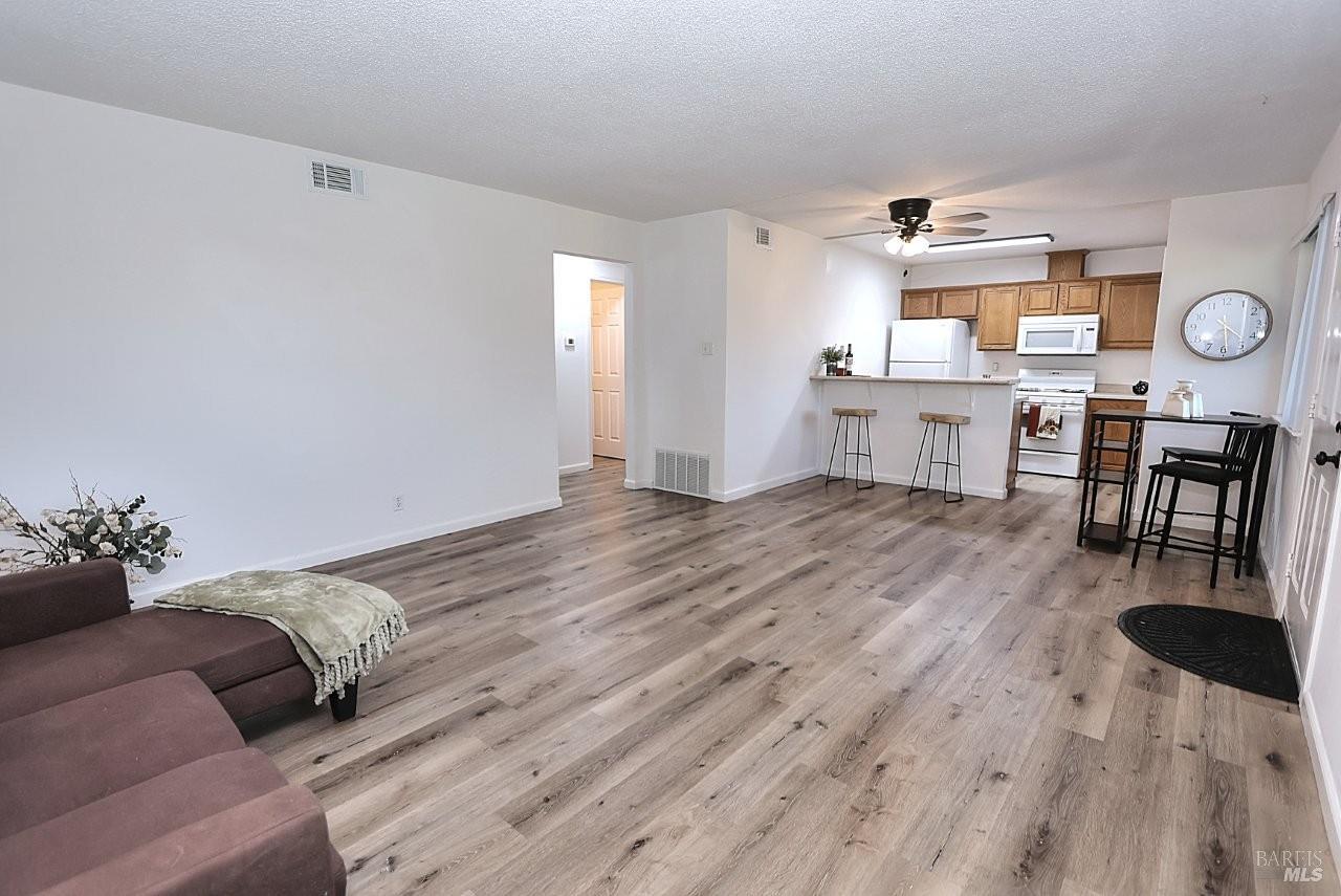 1970 Peabody Road, Unit 1 Vacaville, CA 95687 - Photo 6 of 16 a living room with furniture and wooden floor
