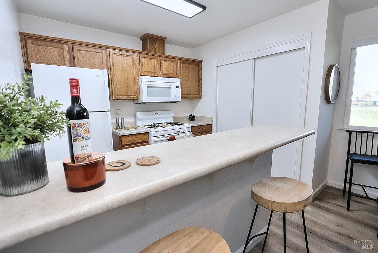 1970 Peabody Road, Unit 1 Vacaville, CA 95687 - Photo 7 of 16 a kitchen with a table and chairs in it