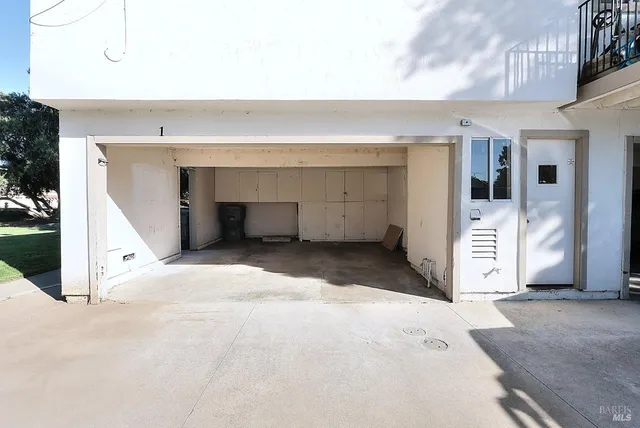 a kitchen with a table and chairs in it