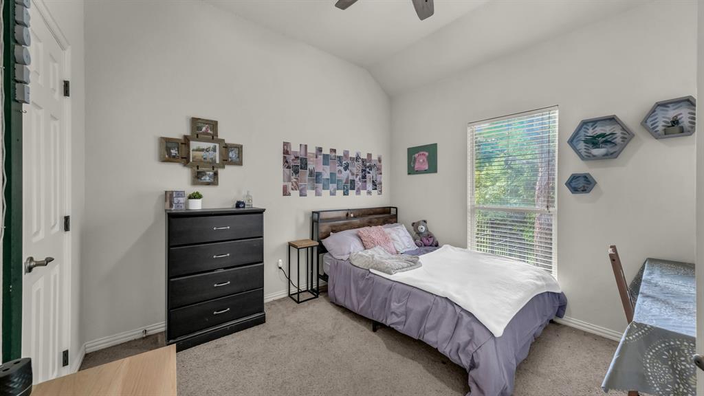 203 Mockingbird Lane Aledo, TX 76008 - Photo 29 of 37 Carpeted room featuring a vaulted ceiling and a ceiling fan