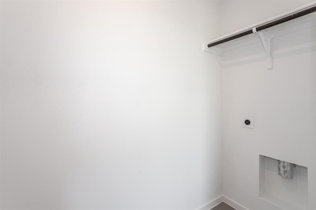 1419 Merlin Blf Street Forney, TX 75126 - Photo 20 of 24 Laundry area featuring a hanging rod, shelf, and utility connections