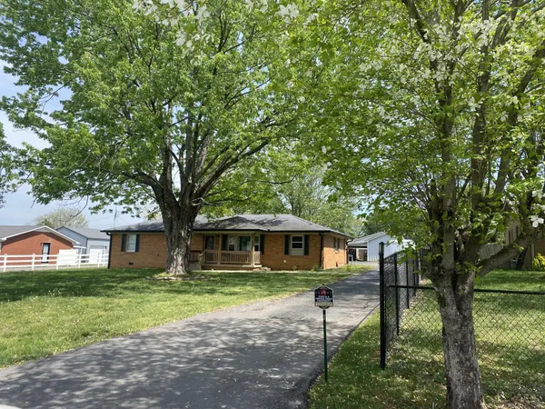 a house that has tree in front of it
