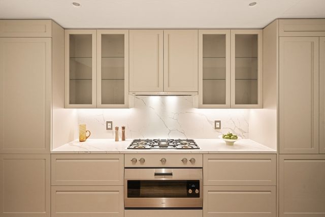 a kitchen with a stove and a cabinets