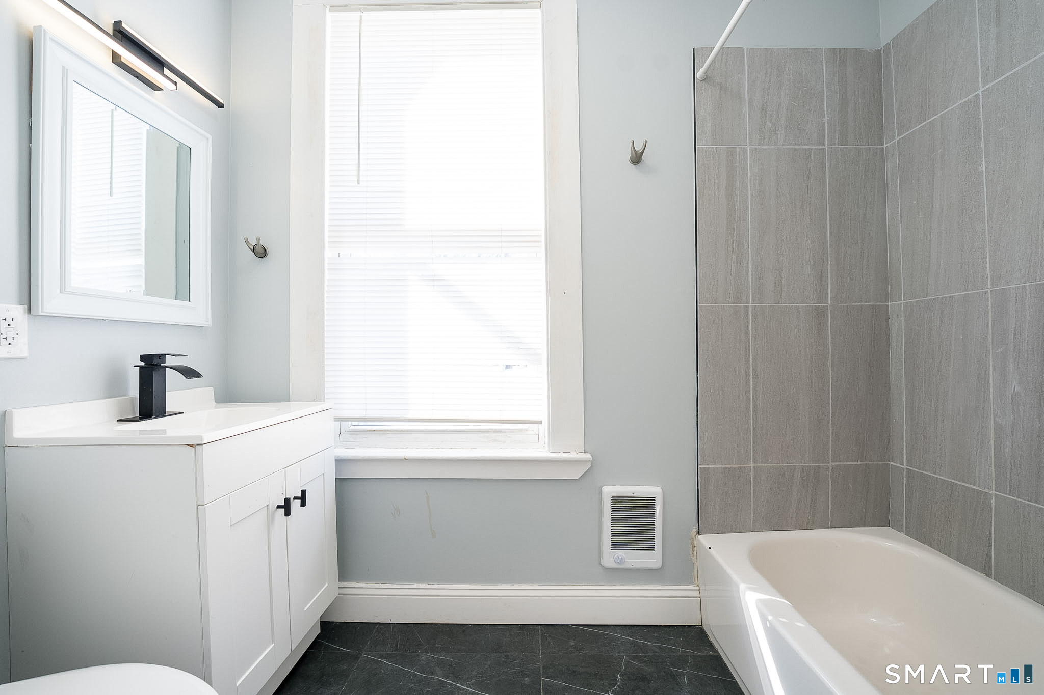 121 Hawthorne Avenue Derby, CT 06418 - Photo 11 of 12 a bathroom with a sink a toilet and shower