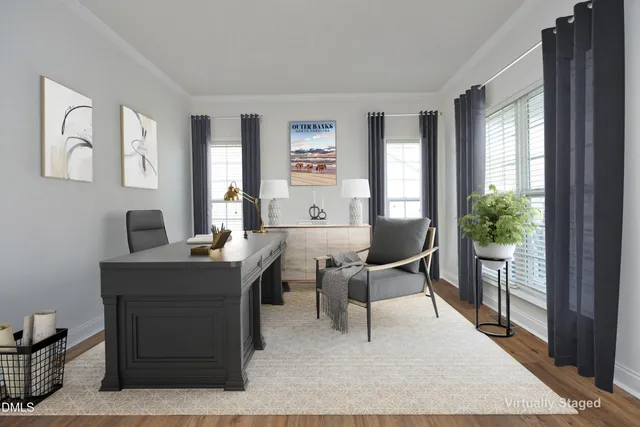 a work room with furniture and a window