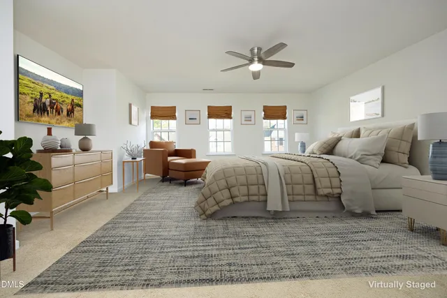 a bedroom with a large bed and a couch