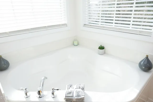 a bathroom with a sink and a window