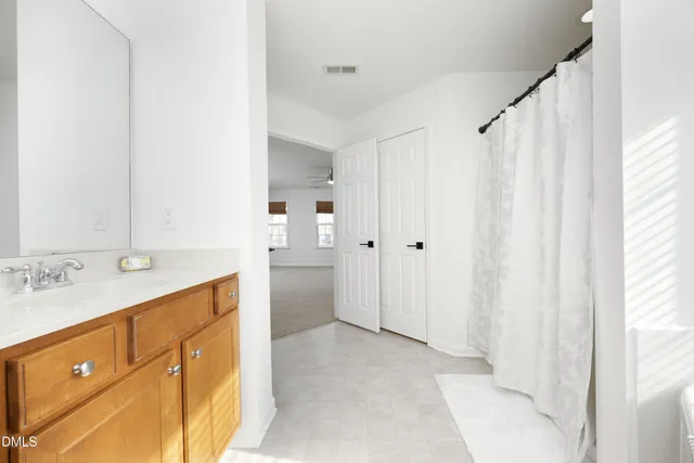 a bathroom with a sink double vanity and a mirror
