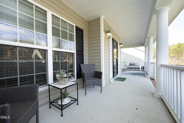 a outdoor space with a large window and couch