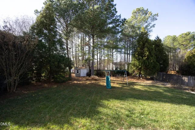 a view of a playground with a tree