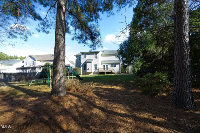 a view of a park with large trees