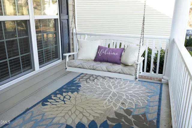 a bedroom with a large bed and a potted plant