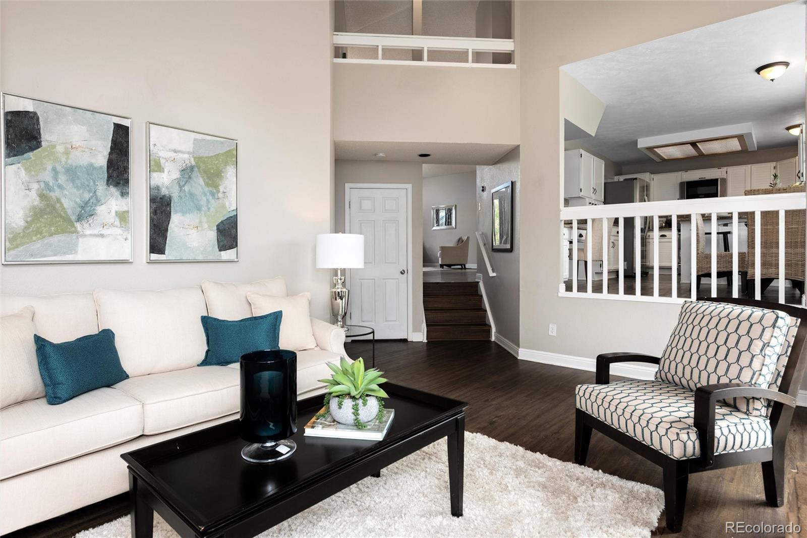1225 East Goldsmith Drive Highlands Ranch, CO 80126 - Photo 20 of 40 a living room with furniture and a rug