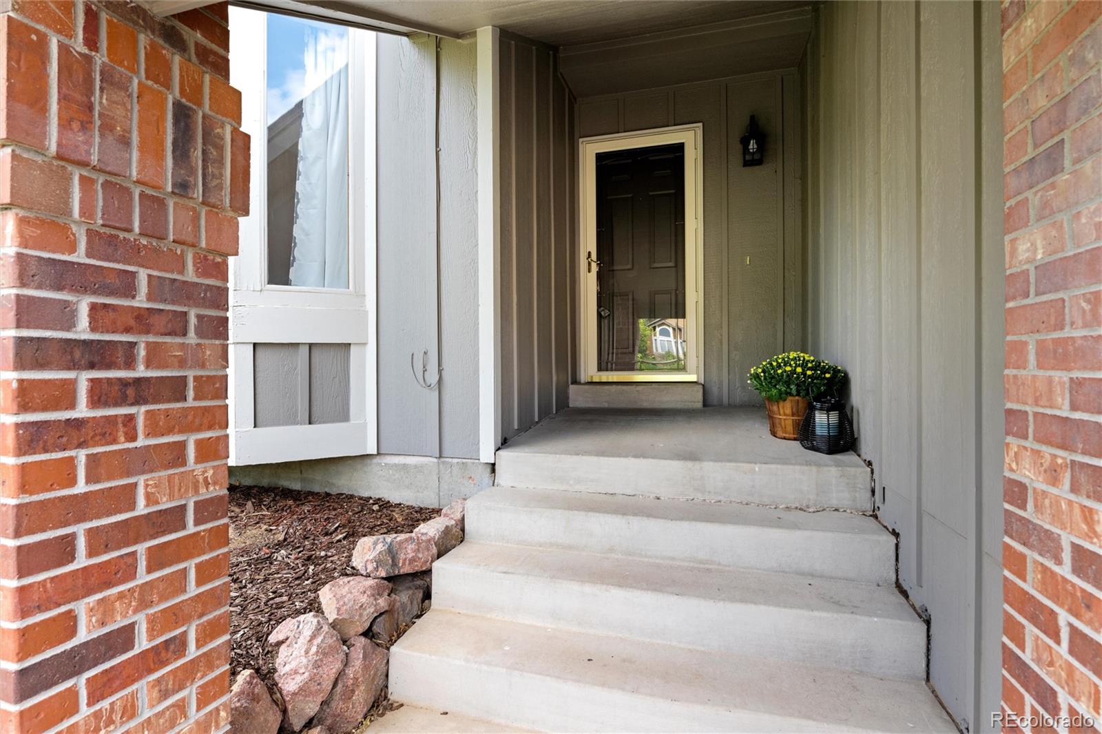 1225 East Goldsmith Drive Highlands Ranch, CO 80126 - Photo 3 of 40 a view of a entryway door of the house
