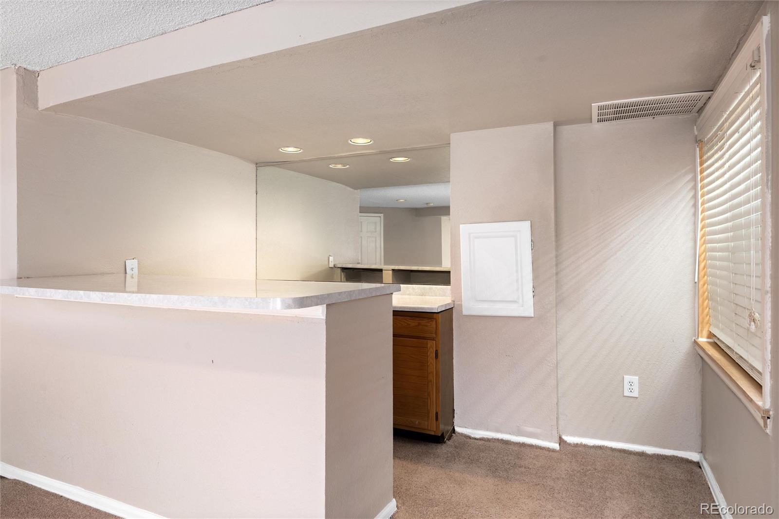 1225 East Goldsmith Drive Highlands Ranch, CO 80126 - Photo 32 of 40 a kitchen with a refrigerator and a sink
