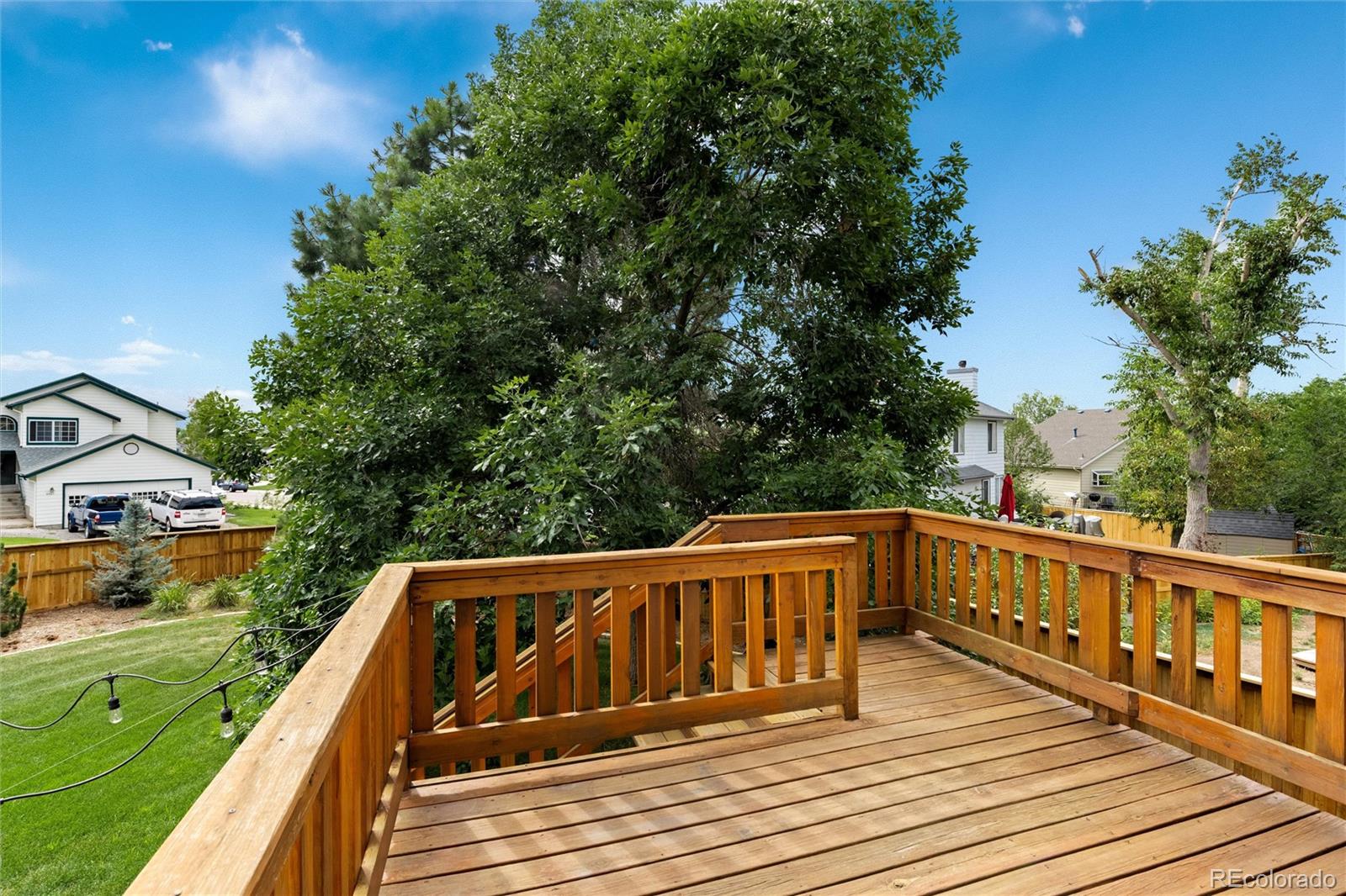 1225 East Goldsmith Drive Highlands Ranch, CO 80126 - Photo 33 of 40 a view of deck with patio and yard