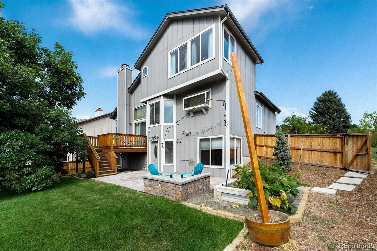 1225 East Goldsmith Drive Highlands Ranch, CO 80126 - Photo 40 of 40 a front view of a house with garden and sitting area