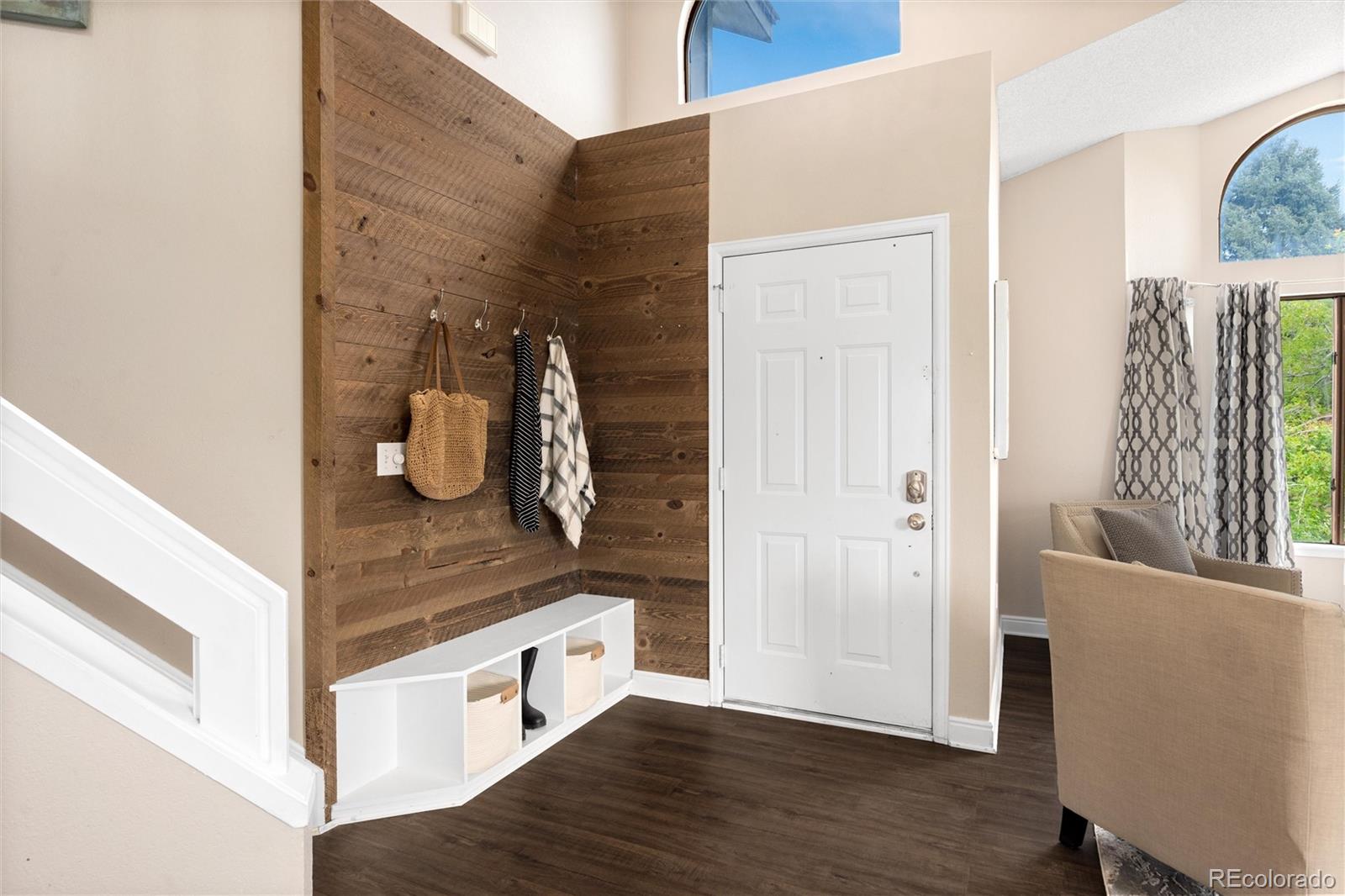 1225 East Goldsmith Drive Highlands Ranch, CO 80126 - Photo 4 of 40 a view of a kitchen cabinets and wooden floor