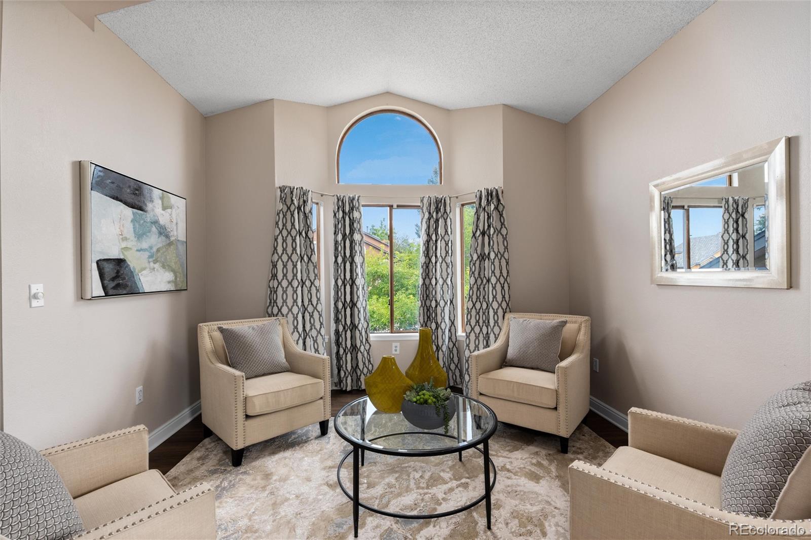 1225 East Goldsmith Drive Highlands Ranch, CO 80126 - Photo 6 of 40 a living room with furniture and a window