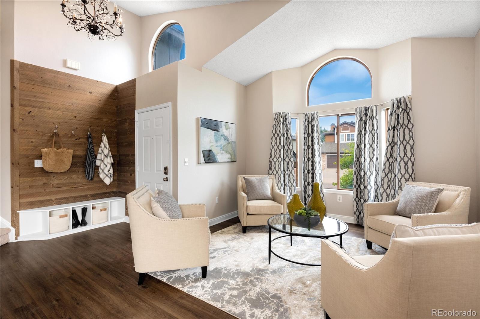 1225 East Goldsmith Drive Highlands Ranch, CO 80126 - Photo 7 of 40 a living room with furniture and wooden floor