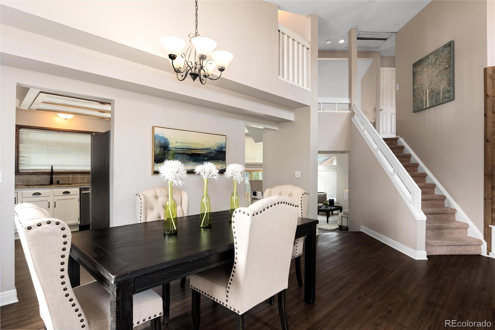 1225 East Goldsmith Drive Highlands Ranch, CO 80126 - Photo 9 of 40 a view of a dining room with furniture and wooden floor