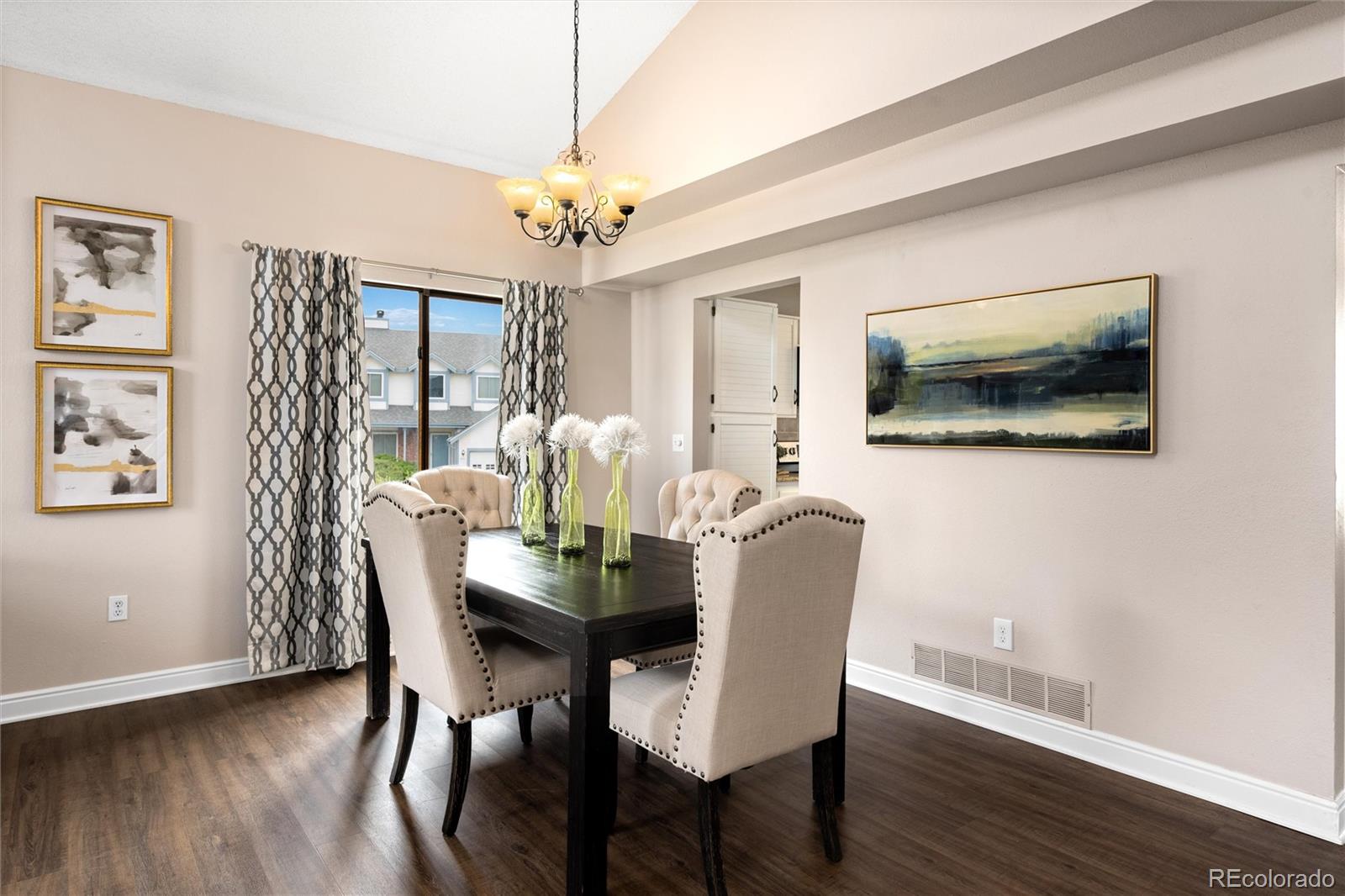 1225 East Goldsmith Drive Highlands Ranch, CO 80126 - Photo 10 of 40 a view of a dining room with furniture window and wooden floor