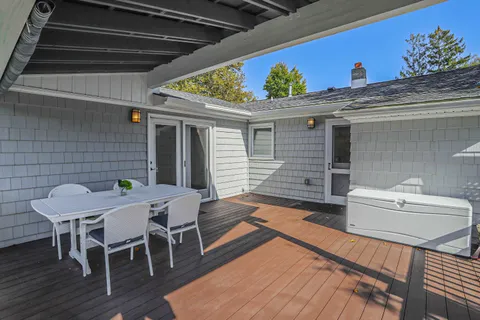 a view of a chairs and table in a patio