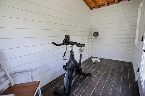 a view of a room with wooden floor