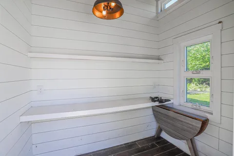a bathroom with a bathtub and window