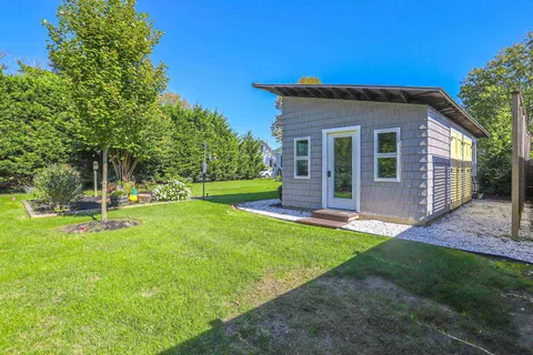 a view of a backyard with a garden and plants
