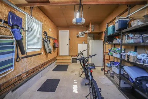 an aerial view of a house with a garden and swimming pool