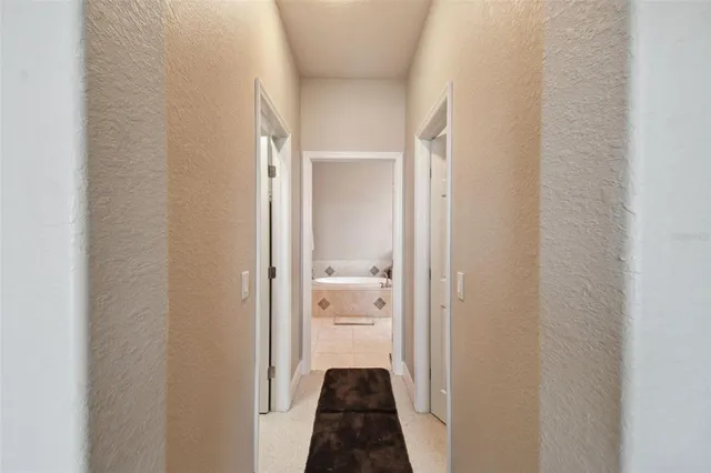 a view of a bedroom from a corridor