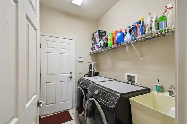 a utility room with dryer and washer