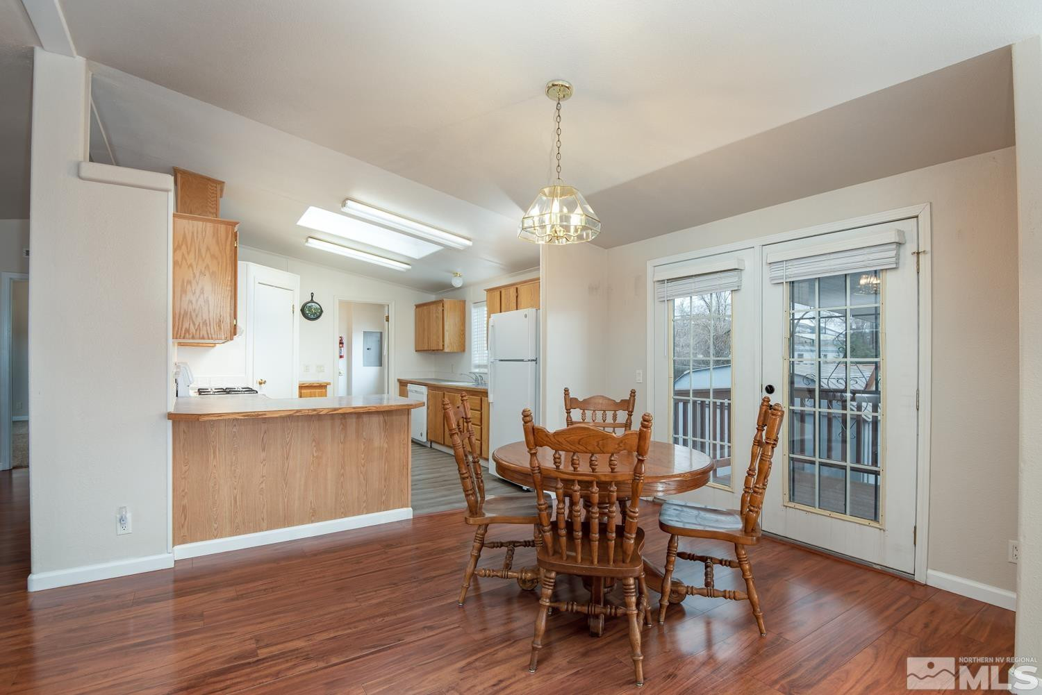 15485 Toll Road Reno, NV 89521 - Photo 5 of 29 a view of a dining room with furniture window and wooden floor